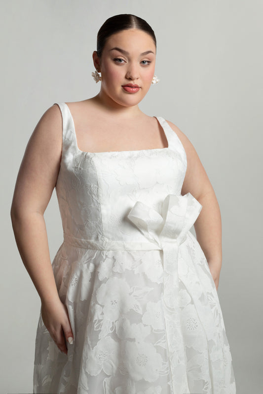 Square neckline bodice with bow detail on waistline, A-line skirt