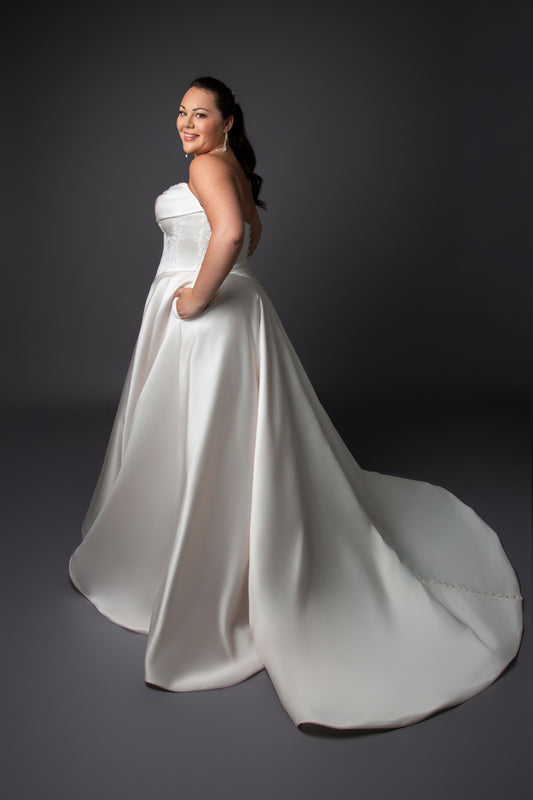 Ruched bustline wedding dress with lace details on bodice