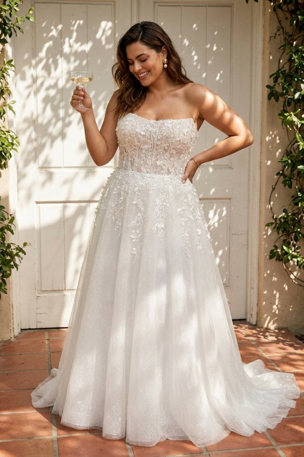 Plus Size A-Line Bridal Gown with Strapless Neckline Delicate Lace Applique and Back Tie Design