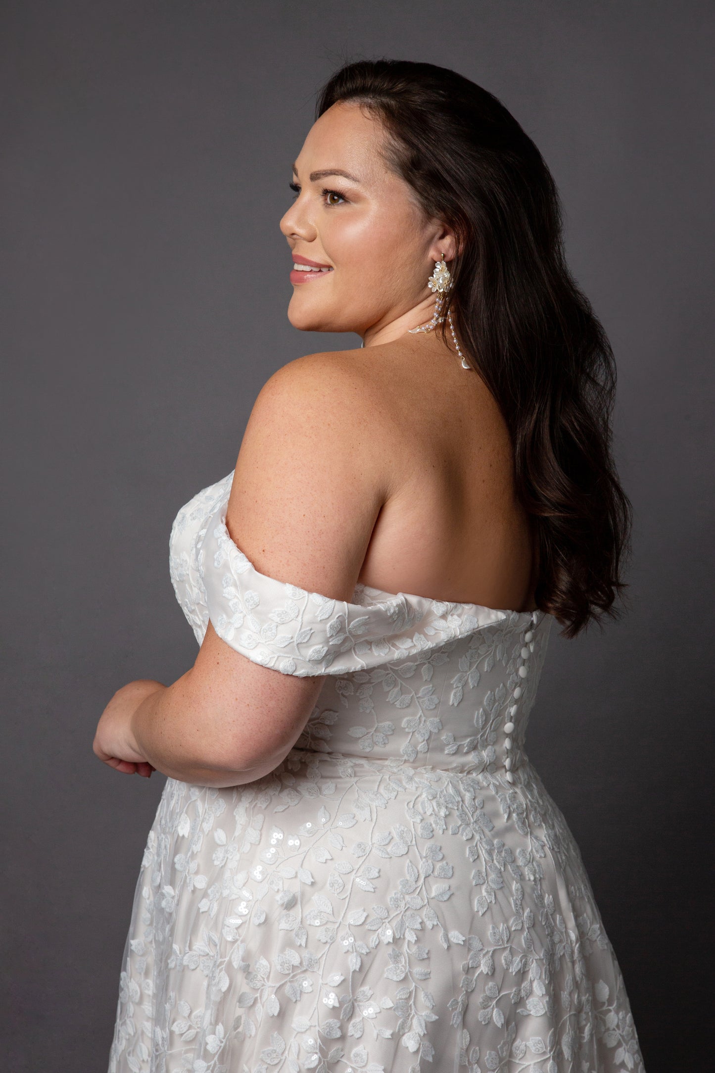 Trailing beaded lace wedding dress with soft scoop neckline drop shoulder