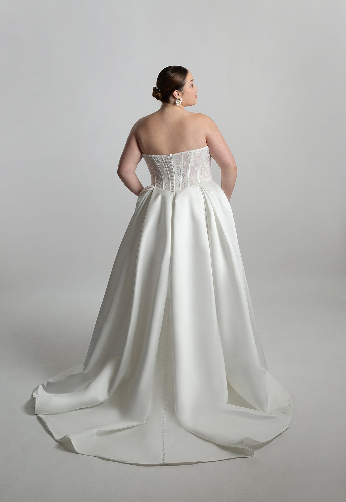 Fully boned lace strapless bodice with box pleated skirt
