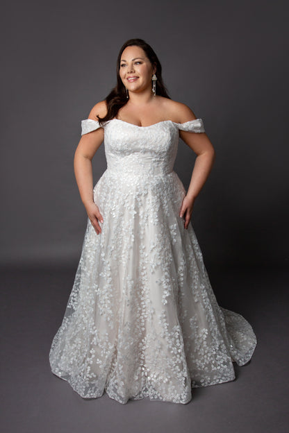 Trailing beaded lace wedding dress with soft scoop neckline drop shoulder