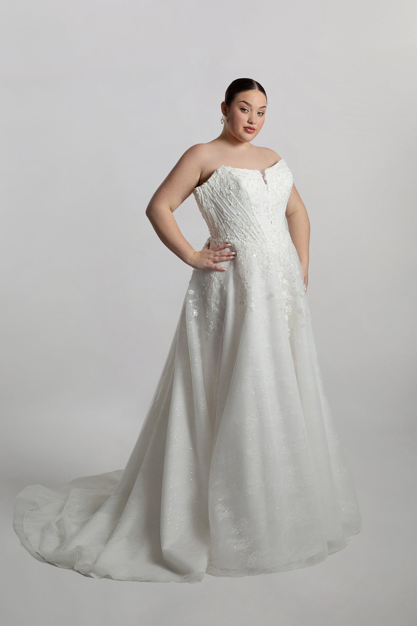 Cat eye neckline channel boned bodice paired with A-line skirt