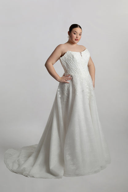 Cat eye neckline channel boned bodice paired with A-line skirt