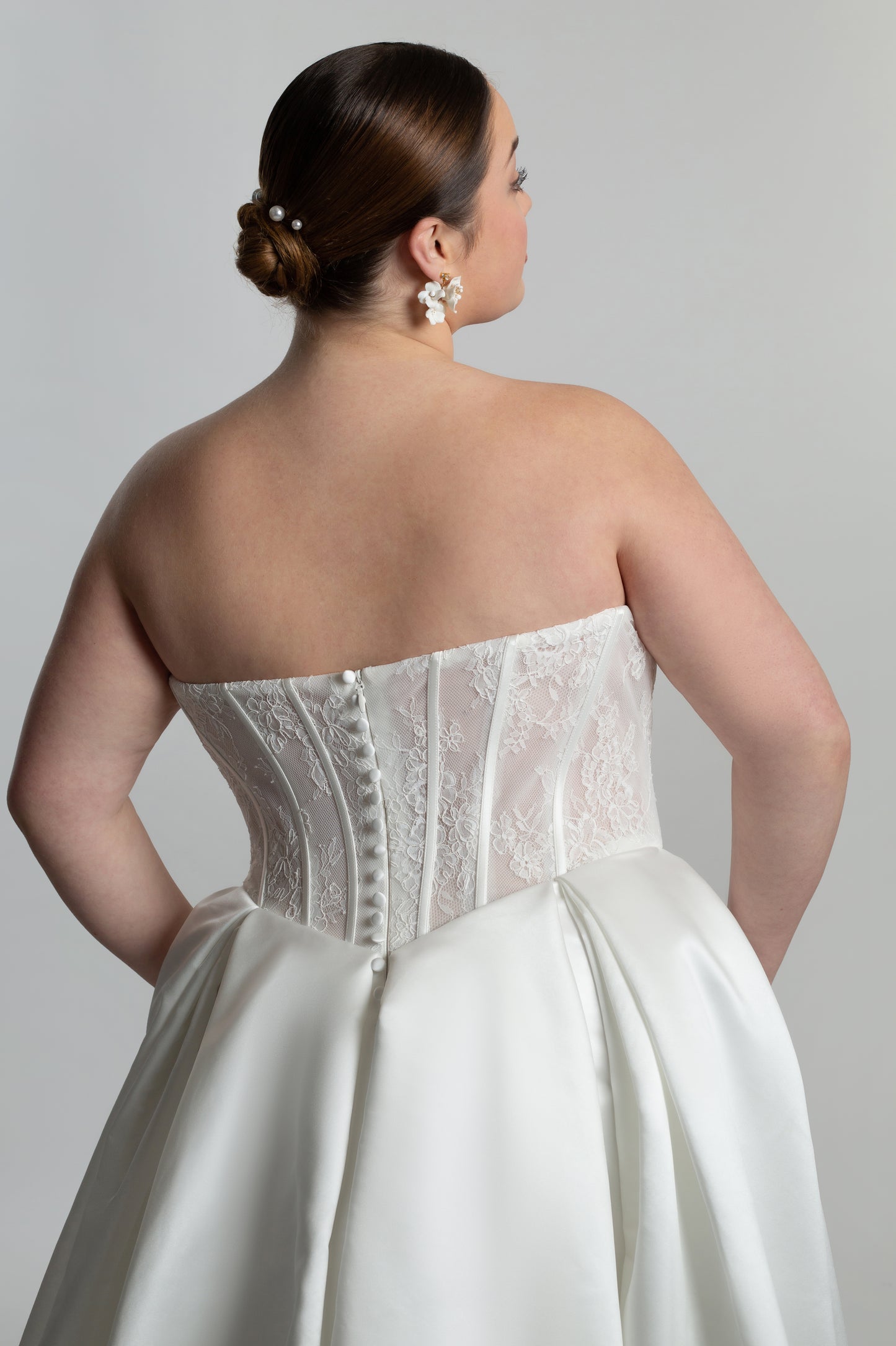 Fully boned lace strapless bodice with box pleated skirt