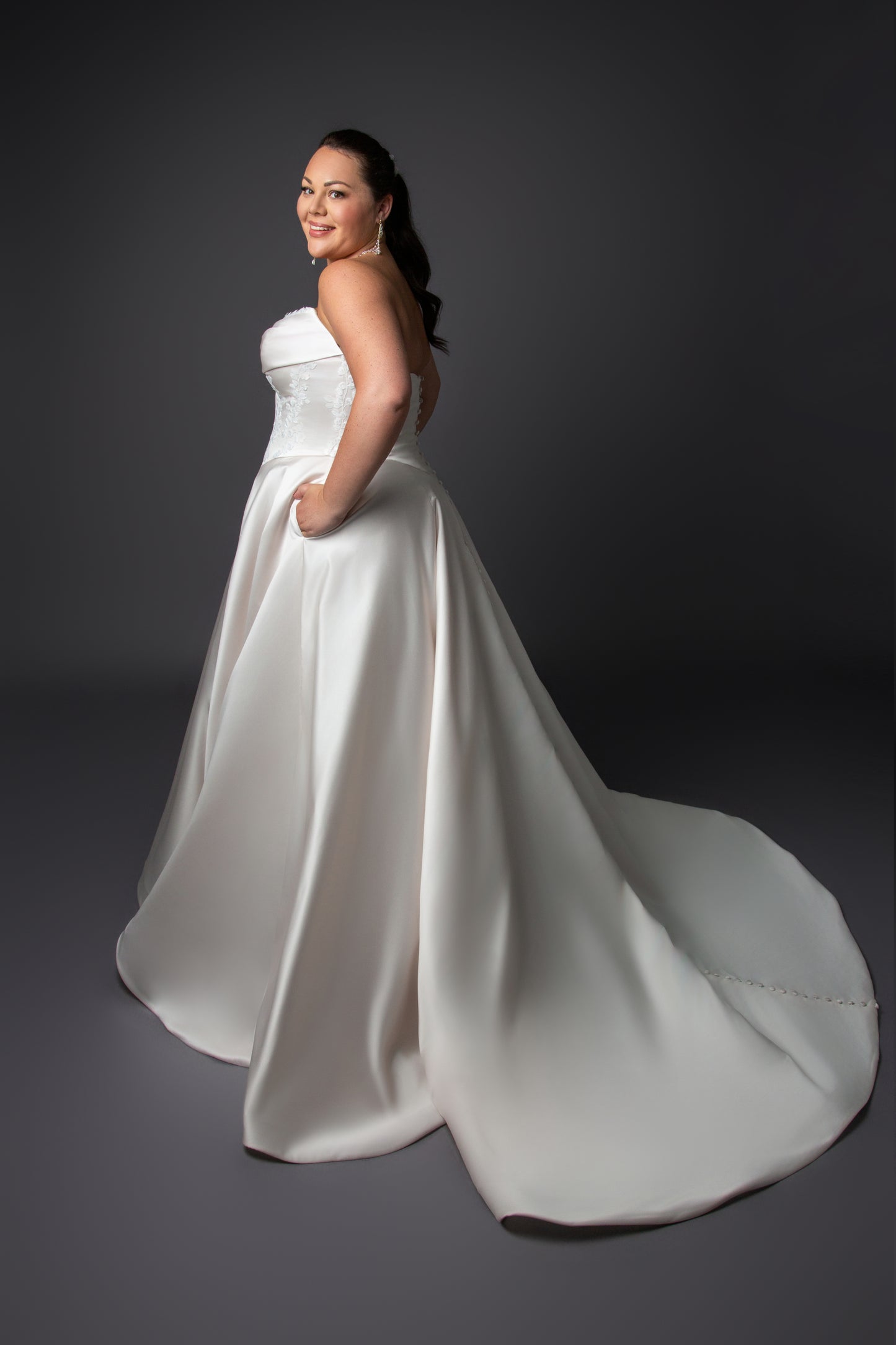 Ruched bustline wedding dress with lace details on bodice