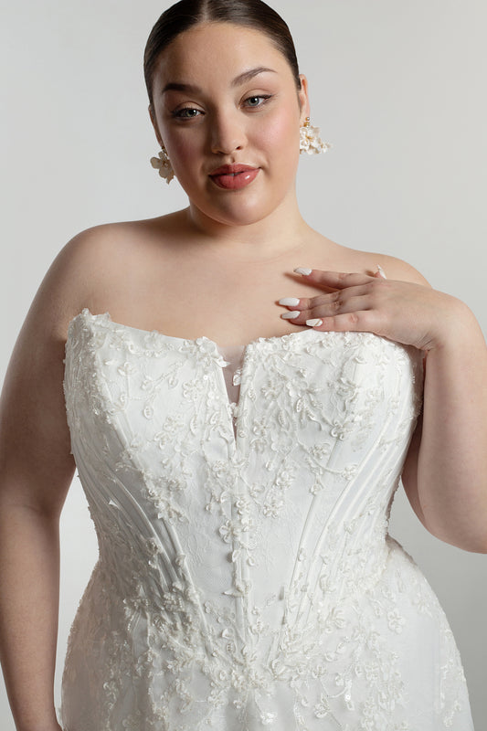 Cat eye neckline channel boned bodice paired with A-line skirt