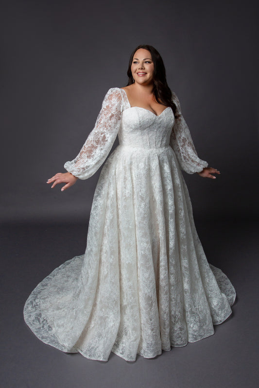 Lace bodice wedding dress with lace balloon sleeves full circular skirt