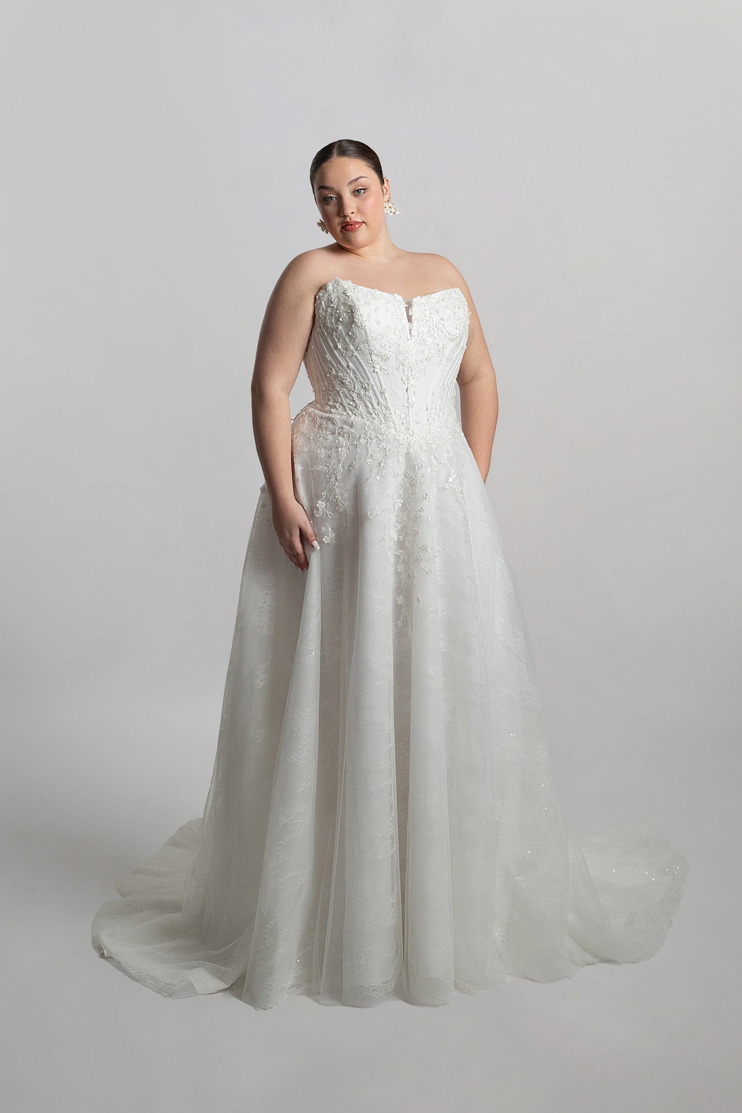 Cat eye neckline channel boned bodice paired with A-line skirt
