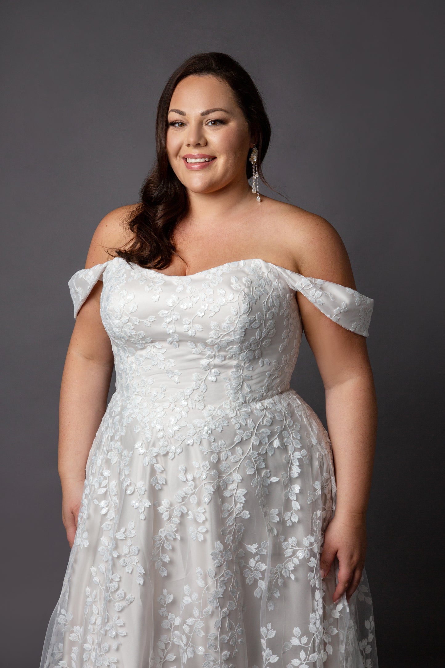 Trailing beaded lace wedding dress with soft scoop neckline drop shoulder