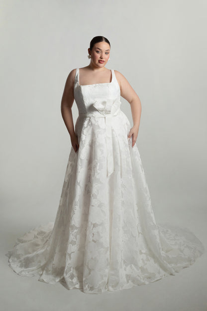 Square neckline bodice with bow detail on waistline, A-line skirt