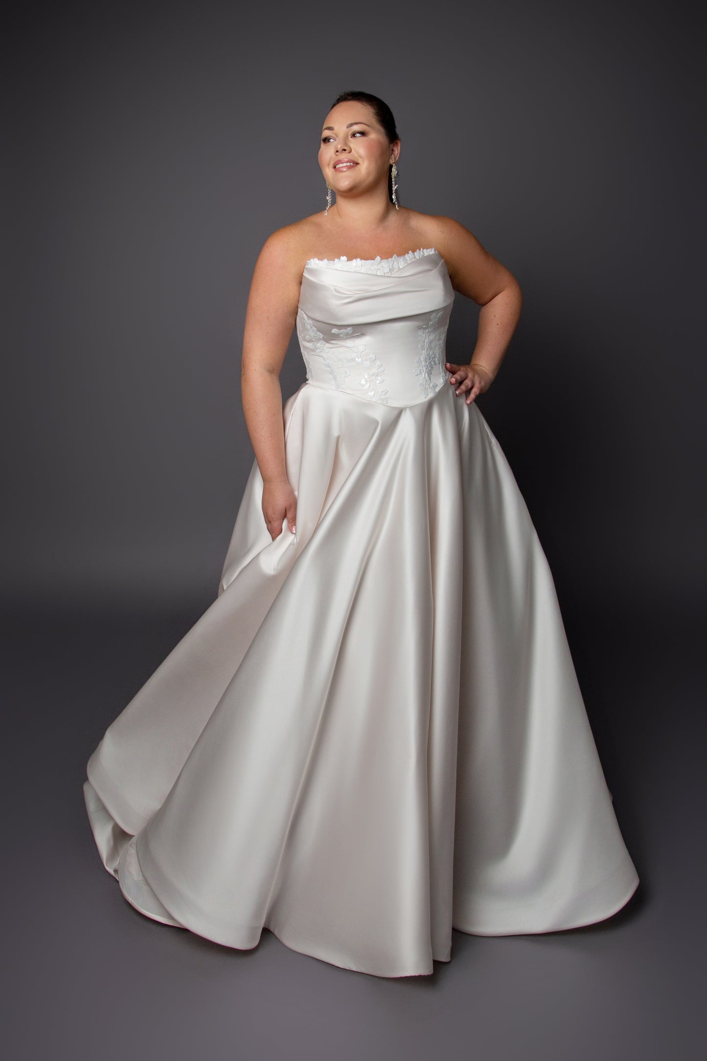 Ruched bustline wedding dress with lace details on bodice