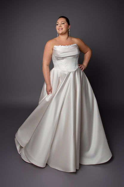 Ruched bustline wedding dress with lace details on bodice