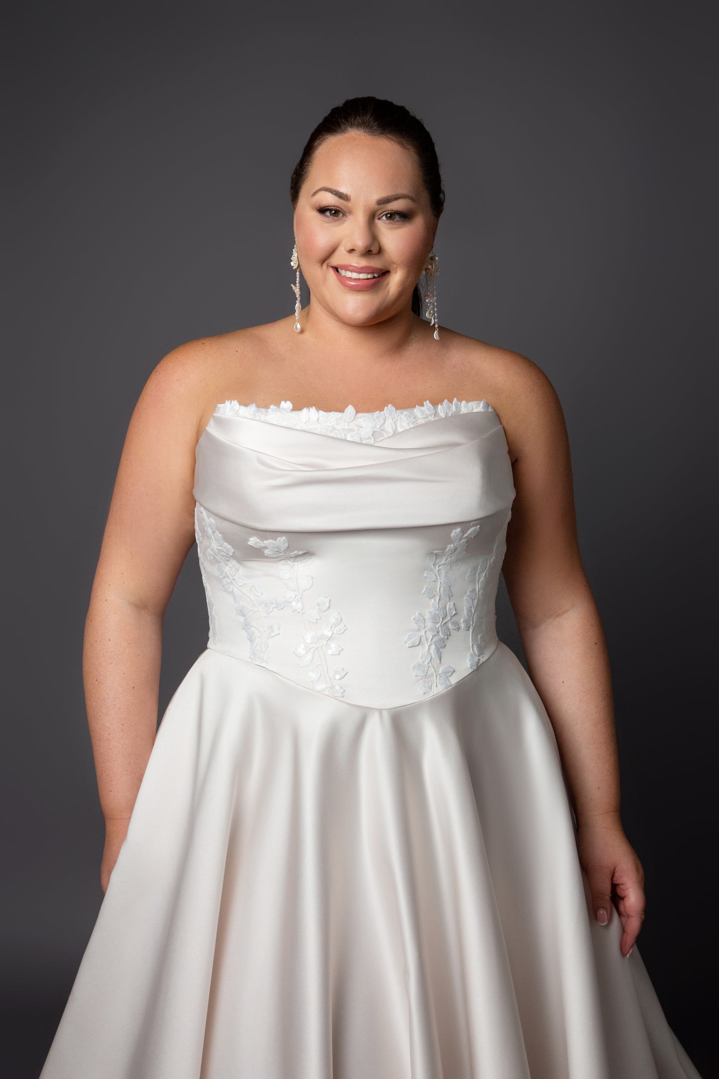 Ruched bustline wedding dress with lace details on bodice