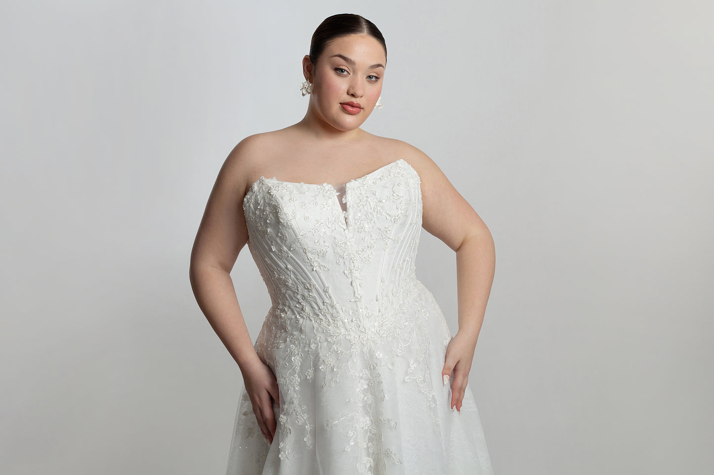 Cat eye neckline channel boned bodice paired with A-line skirt