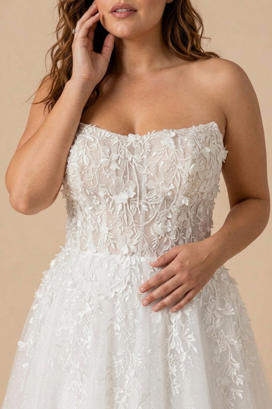 Plus Size A-Line Bridal Gown with Strapless Neckline Delicate Lace Applique and Back Tie Design